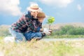 Asian Mom and child girl plant sapling tree in the nature spring for reduce global warming growth feature, Royalty Free Stock Photo